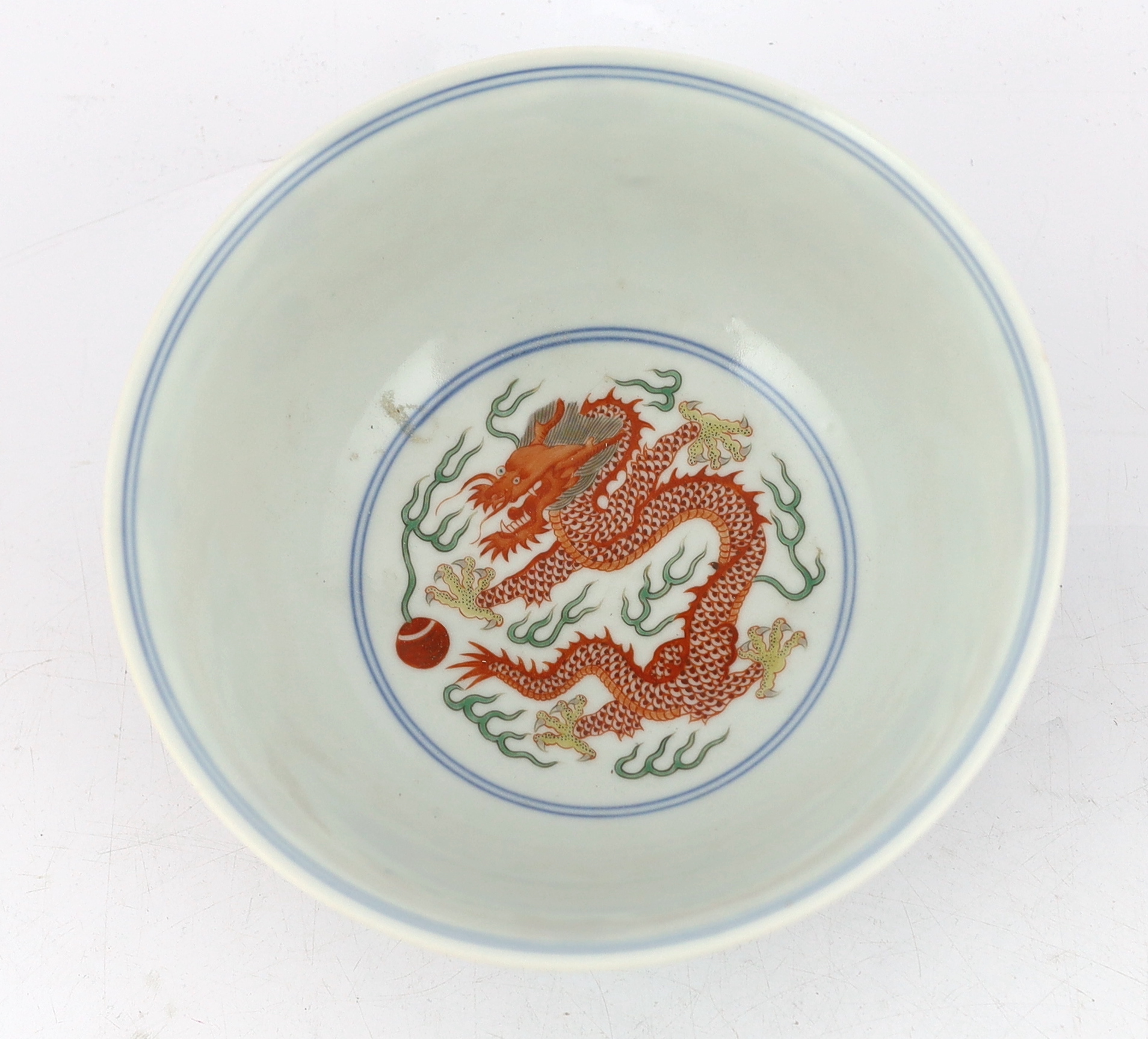 A Chinese wucai ‘dragon and phoenix’ bowl, Qianlong mark and possibly of the period